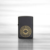 Lifestyle image of Harley-Davidson® Laser Engrave Logo Black Matte Lighter, standing on a reflective sheet of metal