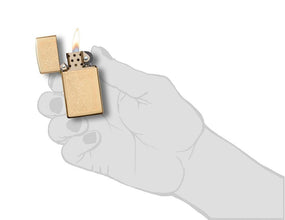 Slim High Polish Brass Venetian Windproof Lighter in hand.