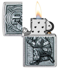 Firefighter Design Street Chrome?äó Windproof Lighter with its lid open and lit.