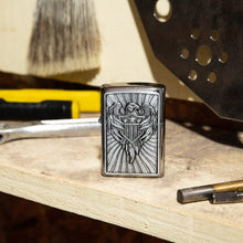 Lifestyle image of Eagle Shield Emblem Design Street Chrome™ Windproof Lighter standing on a workbench with tools.