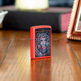 Lifestyle shot of Medusa Design Red Matte Windproof Lighter standing on a sidestand