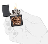 Three Monkeys Black Matte Windproof Lighter lit in hand