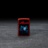 Lifestyle image of Poison Design Metallic Red Windproof Lighter standing in a dark scene.