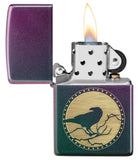 Raven Design Iridescent windproof lighter with its lid open and lit