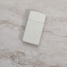 Lifestyle image of Slim?« Mercury Glass Windproof Lighter laying on a marble surface