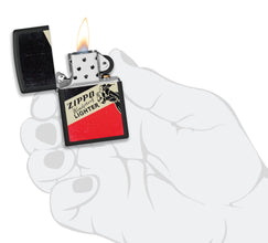 Zippo Windy Design Windproof Lighter lit in hand.