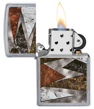 Patterns Design Street Chrome?äó Windproof Lighter with its lid open and lit.