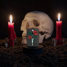 Lifestyle image of Rose Dagger Tattoo Design Black Crackle?« Windproof Lighter standing with a skull and lit candles behind it.