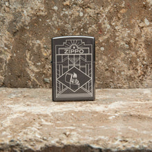 Lifestyle image of Zippo Art Deco Design Black Ice?« Windproof Lighter standing on a counter top.