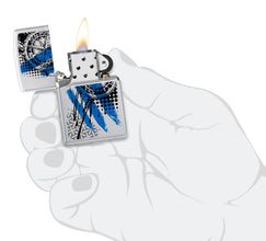 Zippo Trash Polka Tattoo Compass Design Windproof Lighter lit in hand.