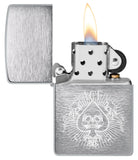 Zippo Spade Skull Design Windproof Lighter with its lid open and lit.