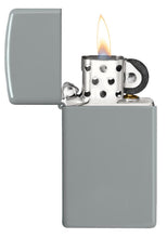 Slim?« Flat Grey Windproof Lighter with its lid open and lit.