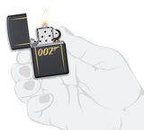 James Bond 007™ Laser Engraved Black Matte Windproof Lighter lit in hand.