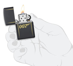 James Bond 007™ Laser Engraved Black Matte Windproof Lighter lit in hand.