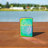 Lifestyle image of Laser Engraved Spiritual Design Multi Color Windproof Lighter standing on a railing with a lake behdind it.