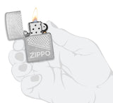 Zippo Design Windproof Lighter lit in hand.